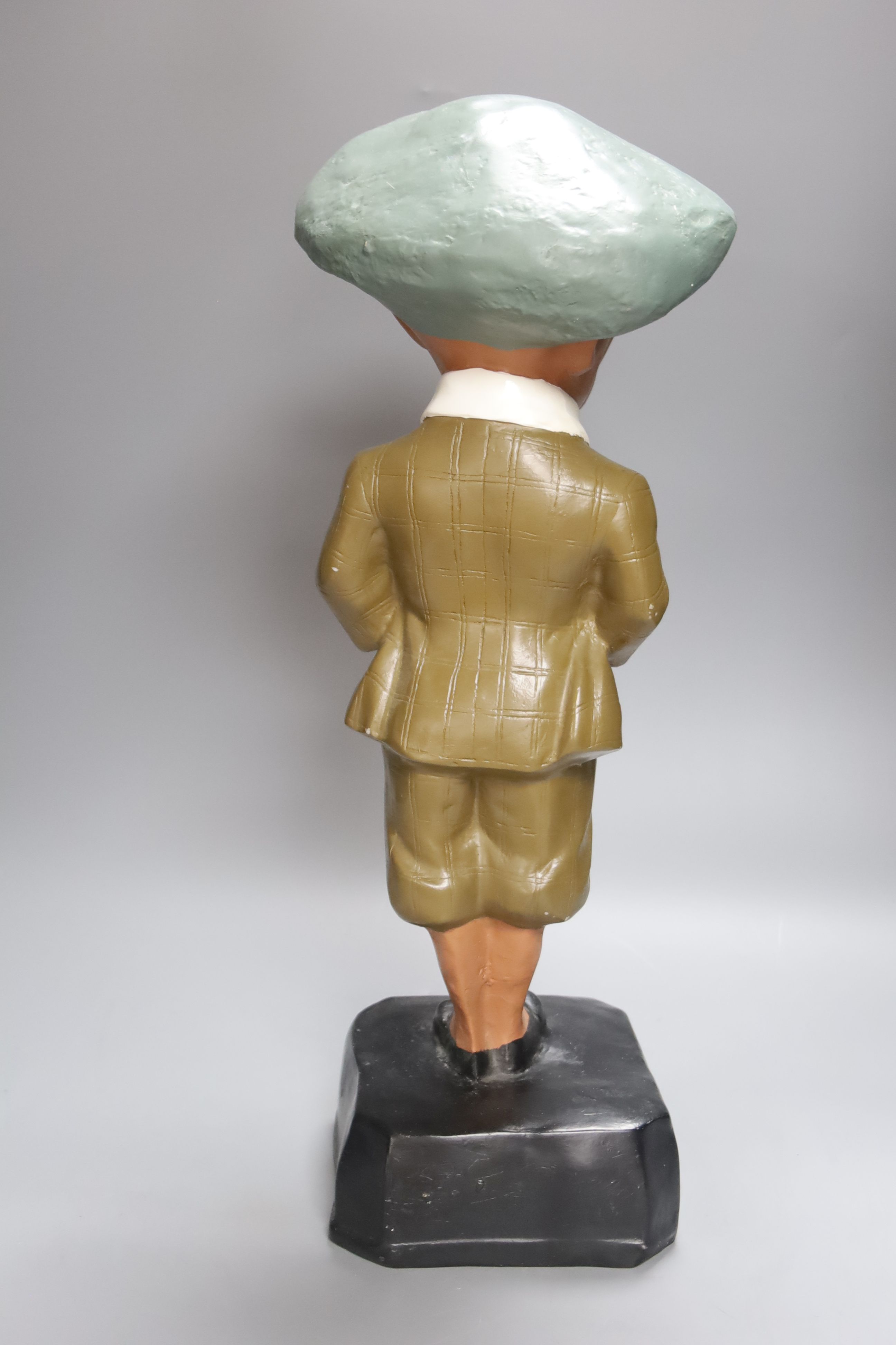 A composition golfing figure He played a Penfold, height 50cm